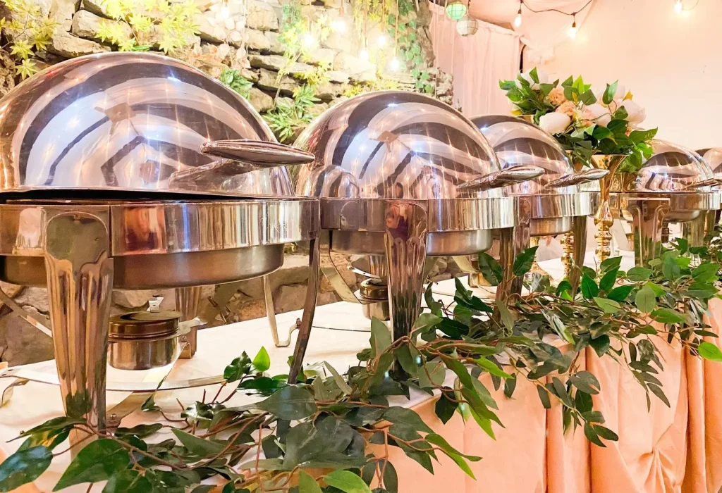 Buffet setup with chafing dishes at Acacia Alley Restaurant & Catering in Santa Rosa, Laguna.